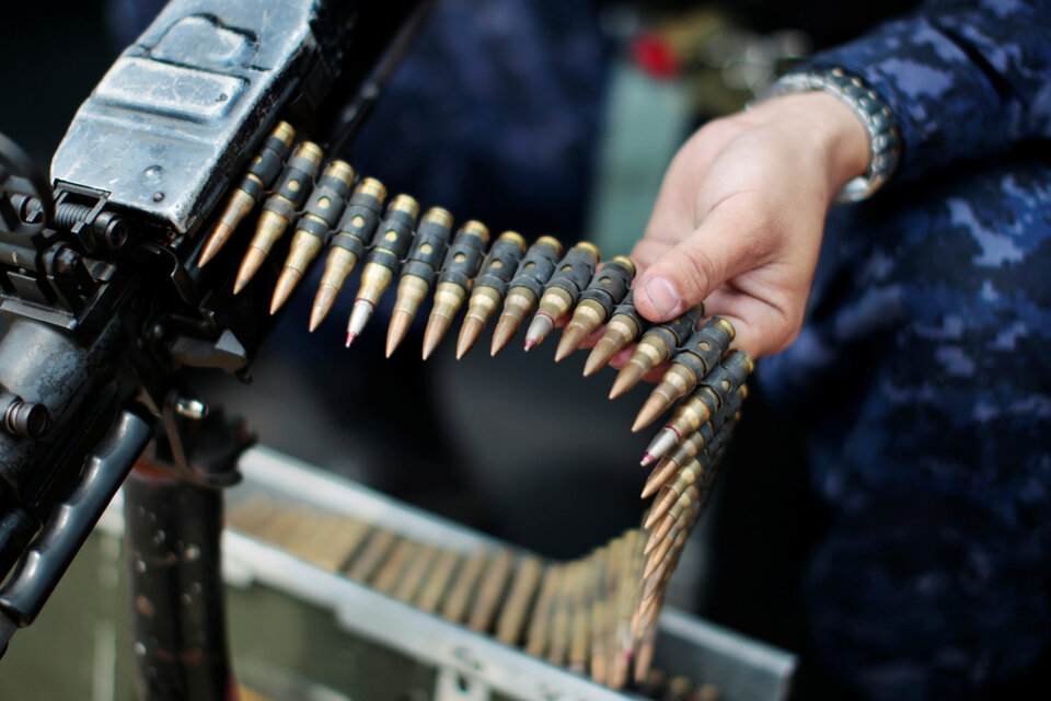 The Indonesian Formed Police Unit (FPU VIII), was detained at the Al Fashir Airport for allegedly attempting to smuggle a large number of weapons and ammunition in January. (Reuters Photo/Jose Cabezas)