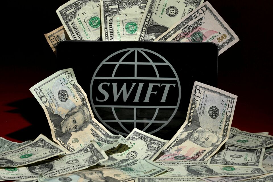 The SWIFT logo is pictured in this photo illustration. (Reuters Photo/Carlo Allegri)