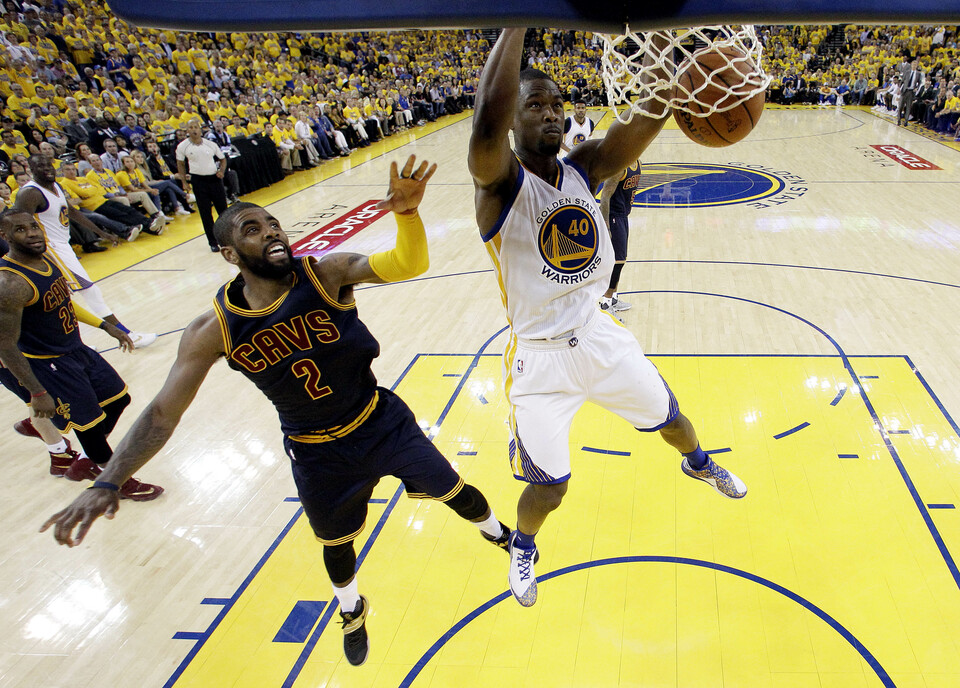 Golden State Warriors forward Harrison Barnes (40) dunks the ball against Cleveland Cavaliers guard Kyrie Irving (2) in game one of the NBA Finals at Oracle Arena. (Reuters Photo/Marcio Jose Sanchez)