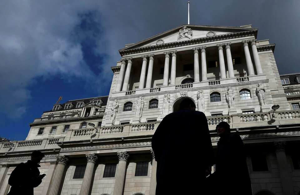 City workers walk past the Bank of England in the City of London, Britain. (Reuters Photo/Toby Melville)