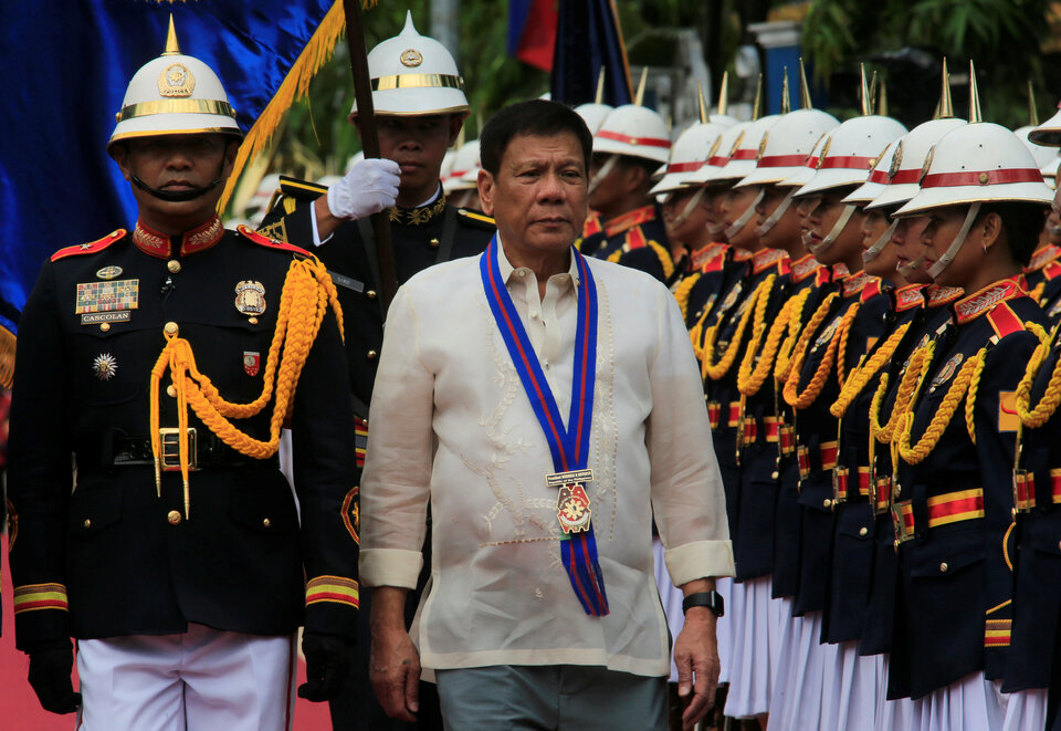 Philippine President Rodrigo Duterte reviews the honor guard upon arrival to the PNP Assumption of Command Ceremony at police headquarters in Quezon city, metro Manila, Philippines, on July 1, 2016. (Reuters Photo/Romeo Ranoco)