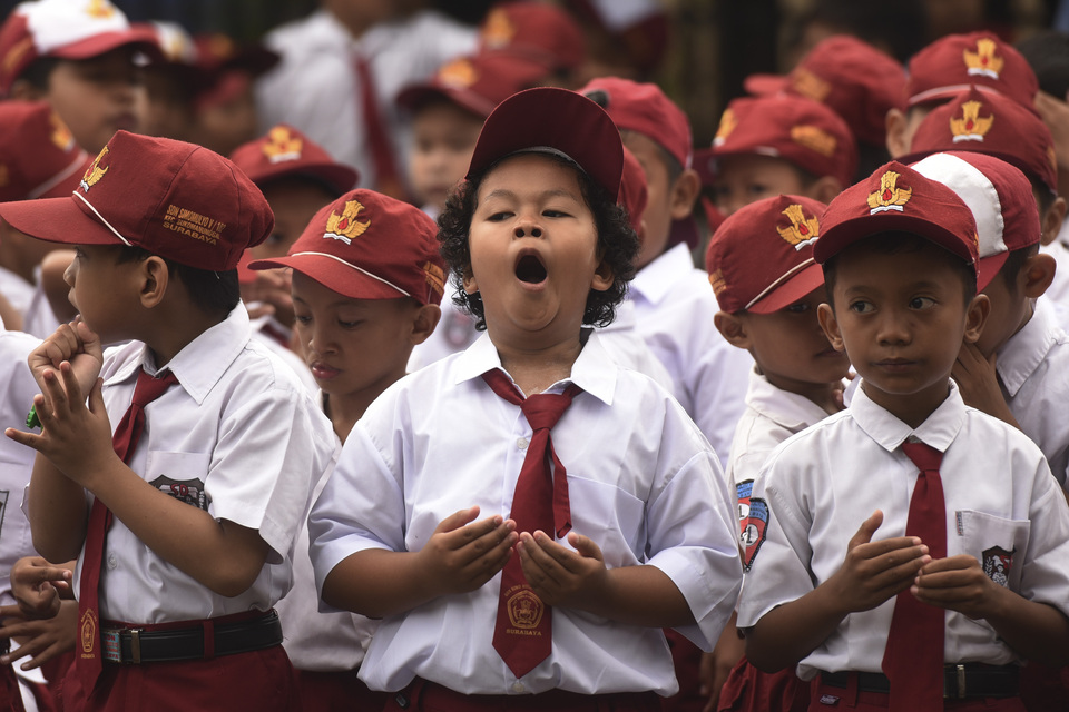 Young students from Surabaya, Central Java, celebrate the first day back to school. (Antara Photo/Zabur Karuru)