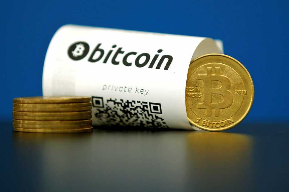 A Bitcoin (virtual currency) paper wallet with QR codes and a coin are seen in an illustration picture taken at La Maison du Bitcoin in Paris, France, May 27, 2015.  (Reuters Photo/Benoit Tessier)