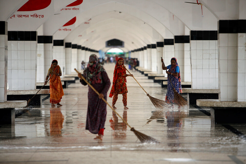 Women clean a platform at the Kamalapur Railway Station in Dhaka, Bangladesh. (Reuters Photo/Mohammad Ponir Hossain)