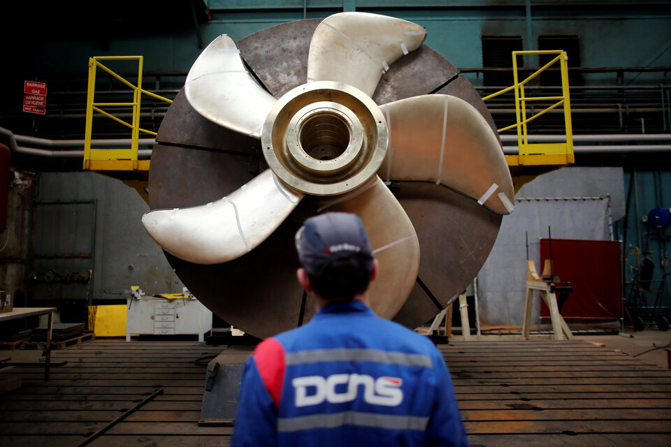 An employee looks at the propeller of a Scorpene submarine at the industrial site of the naval defence company and shipbuilder DCNS in La Montagne near Nantes, France.  (Reuters Photo/Stephane Mahe)