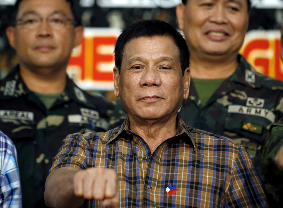 Philippine President Rodrigo Duterte has threatened corrupt government officials with the prospect of being thrown out of a helicopter mid-air, warning he has done it himself before and had no qualms about doing it again. (Reuters Photo/Y.T. Lim)