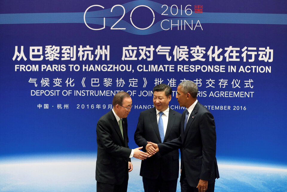 Chinese President Xi Jinping, center, United Nations Secretary General Ban Ki-moon and United States President Barack Obama shake hands during a joint ratification of the Paris climate change agreement ceremony ahead of the G20 Summit in Hangzhou, China, on Sept. 3, 2016. (Reuters Photo/How Hwee Young)