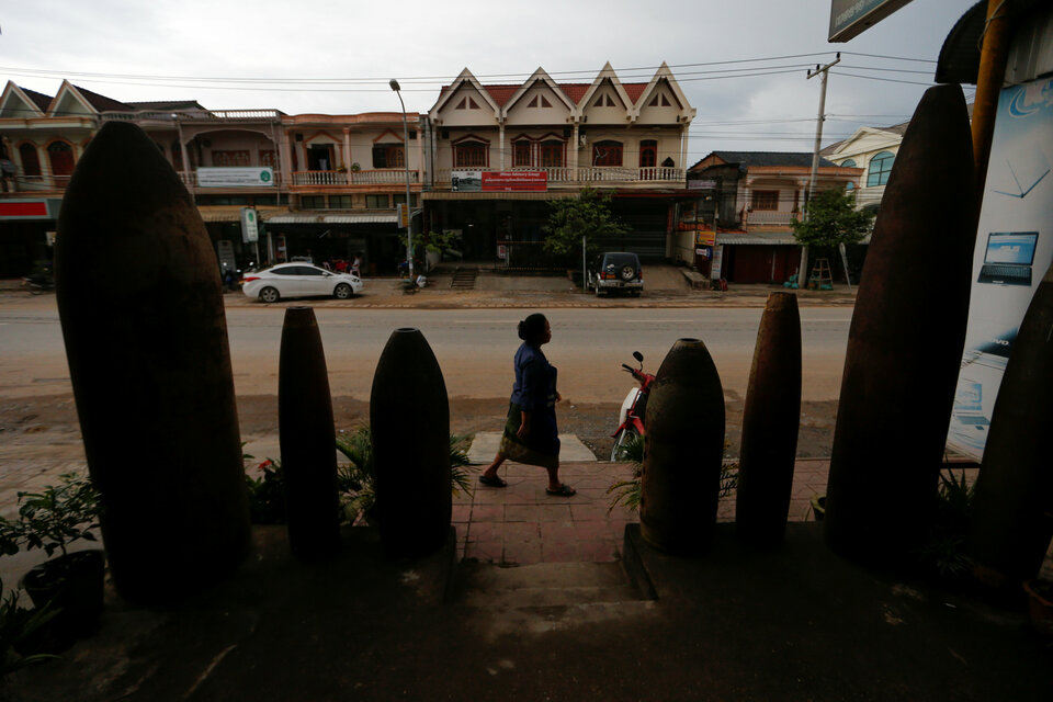 A woman walks past a restaurant in Xieng Khouang, Laos. (Reuters Photo/Jorge Silva)