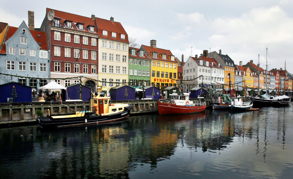 Boats are seen anchored at the 17th century Nyhavn district, home to many shops and restaurants in Copenhagen, Denmark. (Reuters Photo/Bob Strong)