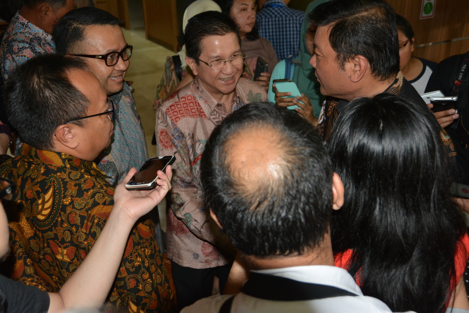 President director of RAPP surrounded by journalists after the meeting with BRG head Nazir Foead, right, after a meeting between RAPP, officials from BRG and environment and forestry ministry in Jakarta on Friday (09/09). (Photo courtesy of RAPP)