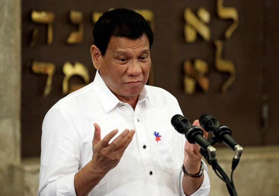 Philippine President Rodrigo Duterte has said he would impose martial law if the drug problem became "very virulent," just a month after dismissing as "nonsense" any suggestion he might do so. (Reuters Photo/Aaron Favila)