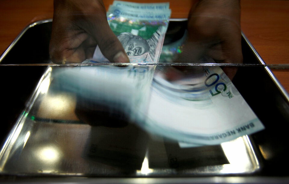 Malaysia's consumer price index rose to an eight-year high in February, but is unlikely to lead to any change in monetary policy.  (Reuters Photo/Bazuki Muhammad)