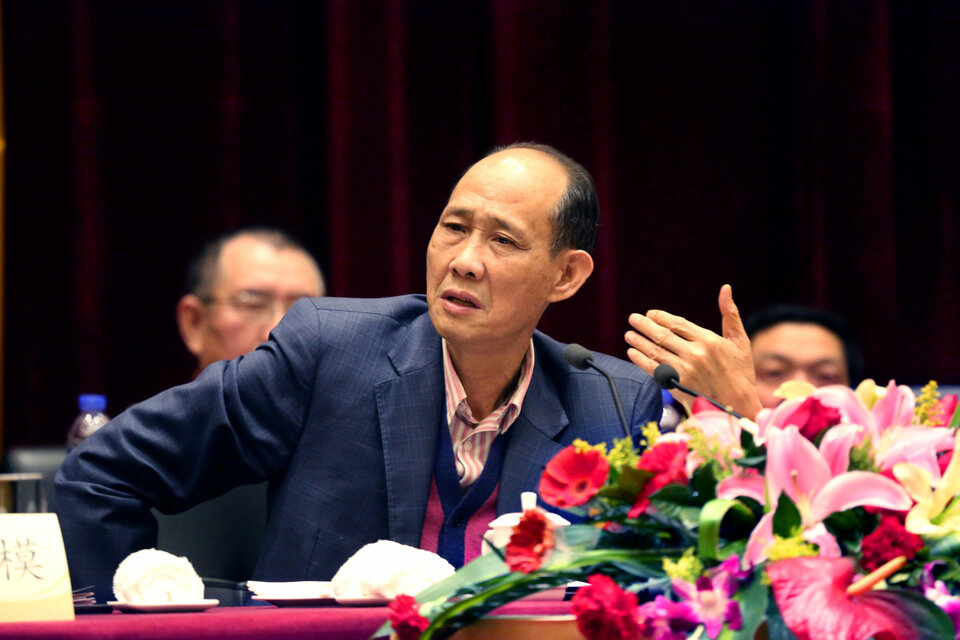 Huang Rulun, head of Century Golden Resources Group attends a meeting in Lianjiang, Fujian province, China, February 4, 2014. Picture taken February 4, 2014. (Reuters Photo/Stringer) 
