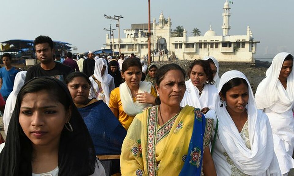 Indian women leave after visiting the inner sanctum of the Haji Ali Dargah in Mumbai. (AFP Photo/Punit Paranjpe)