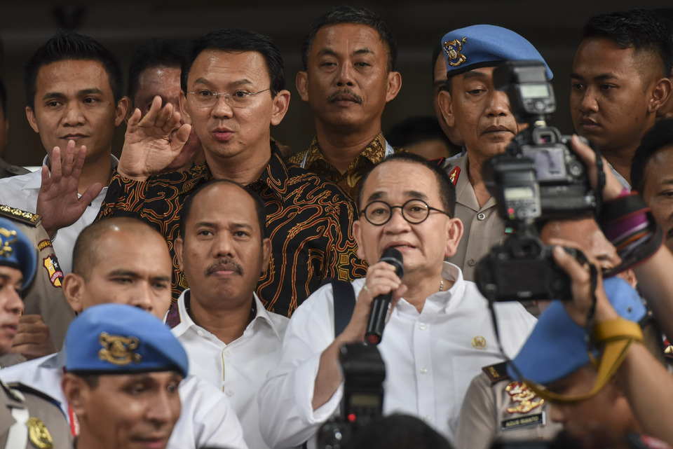 Jakarta governor Basuki 'Ahok' Tjahaja Purnama, second from left, top, after being interrogated by the police earlier this month. (Antara Photo/Hafidz Mubarak A.)