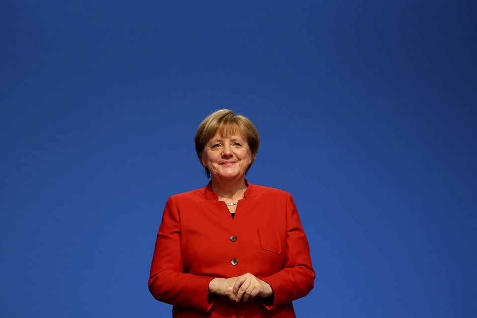 German Chancellor and leader of the conservative Christian Democratic Union party CDU Angela Merkel reacts after she was re-elected as chairwoman at the CDU party convention in Essen, Germany, December 6, 2016.     (Reuters Photo/Kai Pfaffenbach)