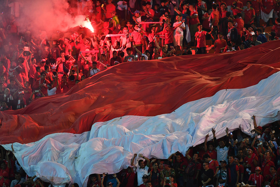 Indonesian supporters during the first leg of the 2016 AFF Cup final between Indonesia and Thailand at the Pakansari Stadium in Bogor, West Java, on Wednesday (14/12). (Antara Photo/Widodo S. Jusuf)