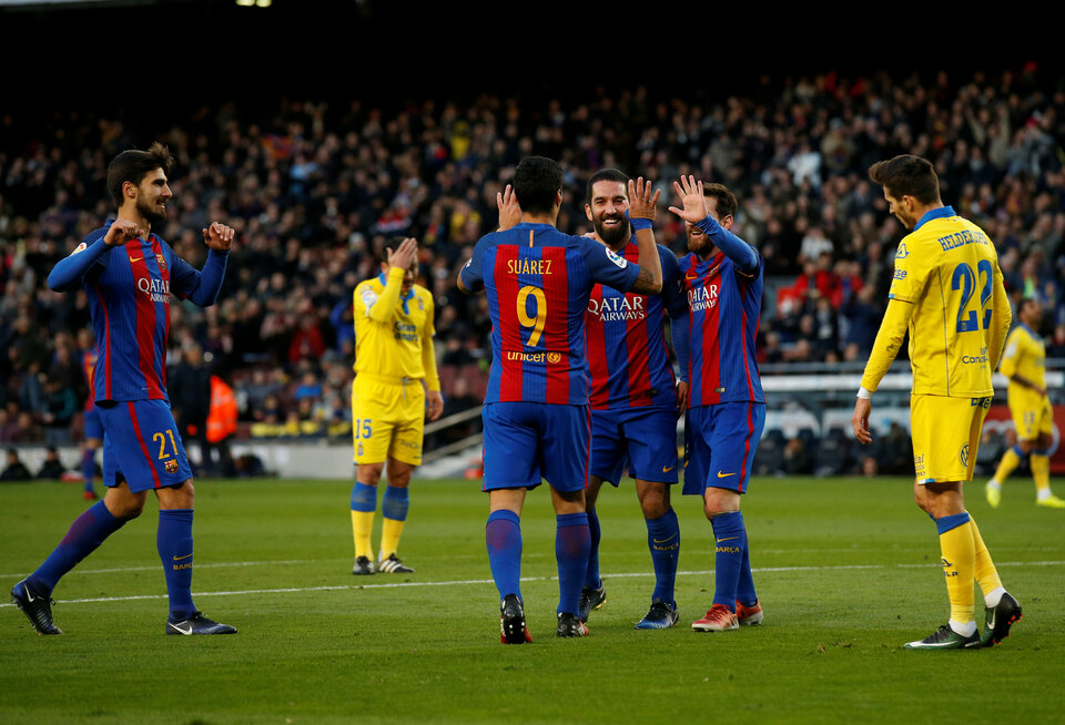 Barcelona's Arda Turan celebrates a goal against Las Palmas with his teammates. (Reuters Photo/Albert Gea)