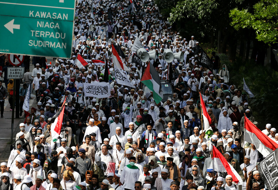 Members of the hardline Islamic Defenders' Front, or FPI, gather in Jakarta earlier this year to demand the resignation of then-Jakarta governor, Basuki 'Ahok' Tjahaja Purnama, a Christian of Chinese descent. (Reuters Photo/Beawiharta)