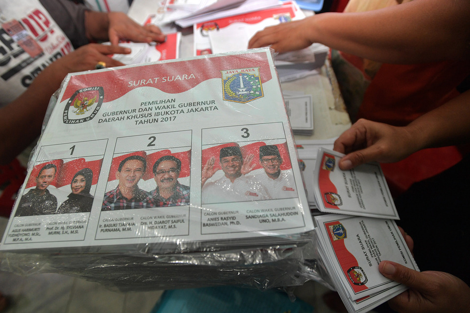 Incumbent Governor Basuki 'Ahok' Tjahaja Purnama and his running mate, Deputy Governor Djarot Saiful Hidayat, are facing off against former education minister Anies Baswedan and businessman Sandiaga Uno, after neither candidate pair managed to secure more than 50 percent of the vote in the first round on Feb. 15. (Antara Photo/Widodo S. Jusuf)