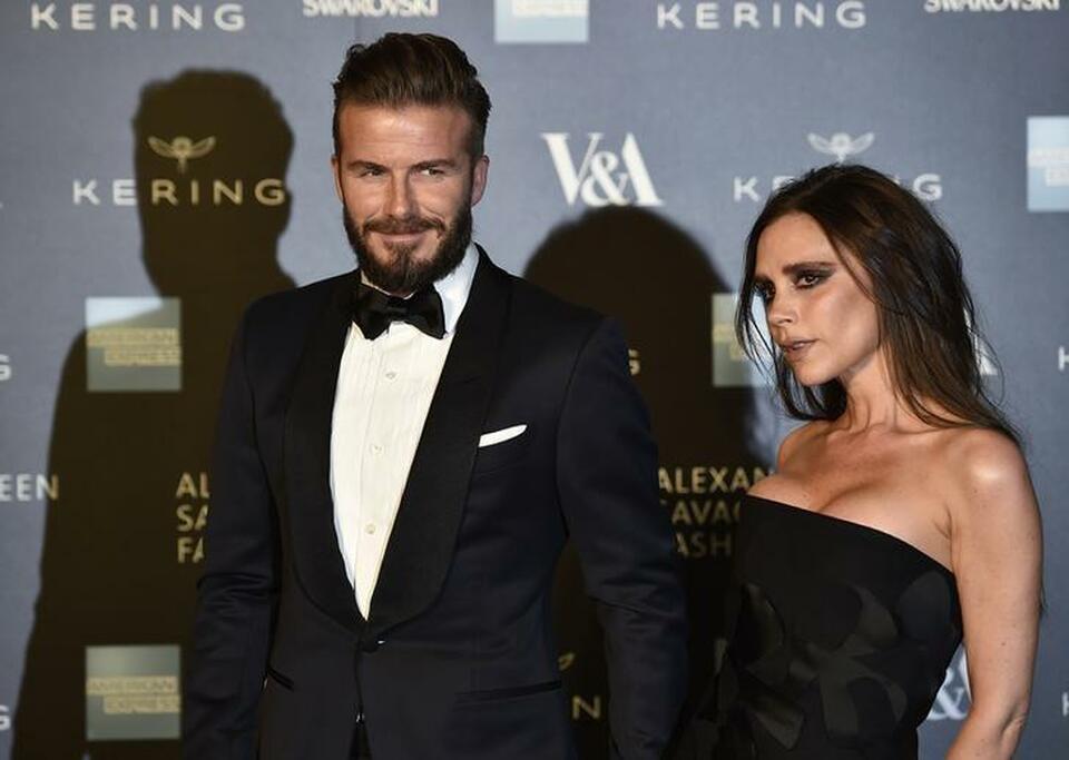 Victoria and David Beckham arrive for the Alexander McQueen: Savage Beauty exhibition gala at the Victoria & Albert Museum in London, March 12, 2015. (Reuters Photo/Toby Melville)