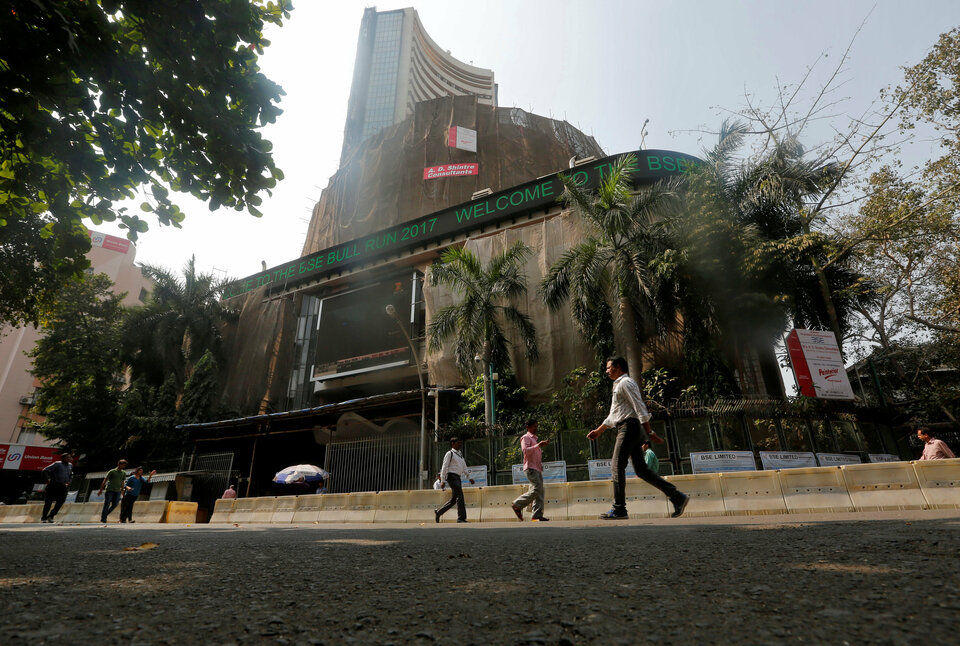 People walk past the Bombay Stock Exchange (BSE) building in Mumbai on Jan. 25. (Reuters Photo/Shailesh Andrade)
