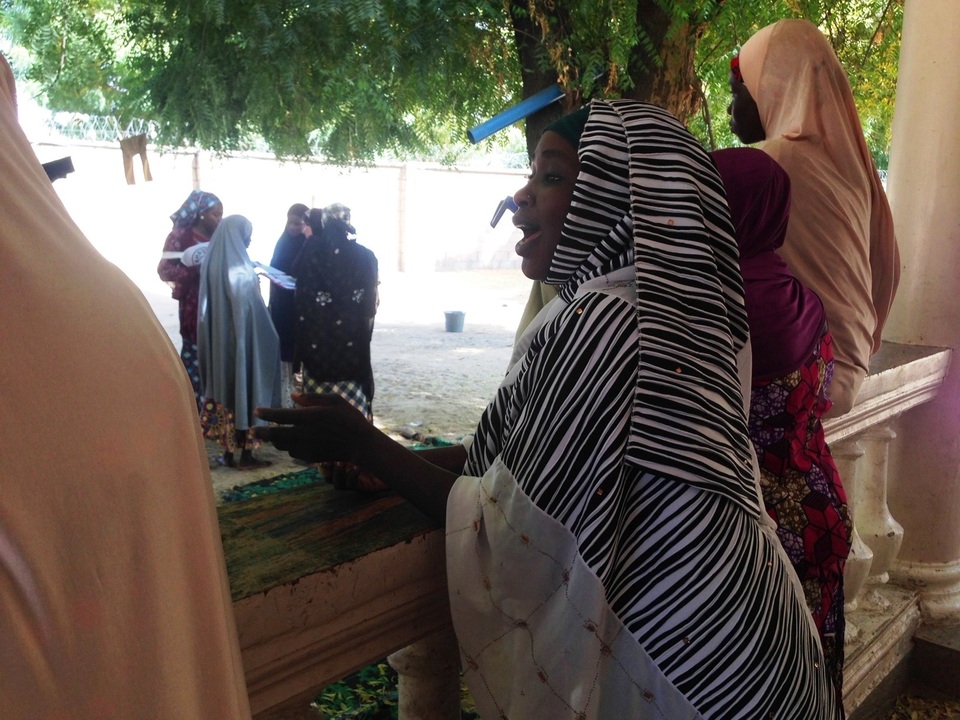 Aisha, the former wife of a Boko Haram commander, talks to another woman at a deradicalisation programe in Maiduguri, Nigeria, on Jan 25. (Reuters Photo/Adaobi Tricia Nwubani)