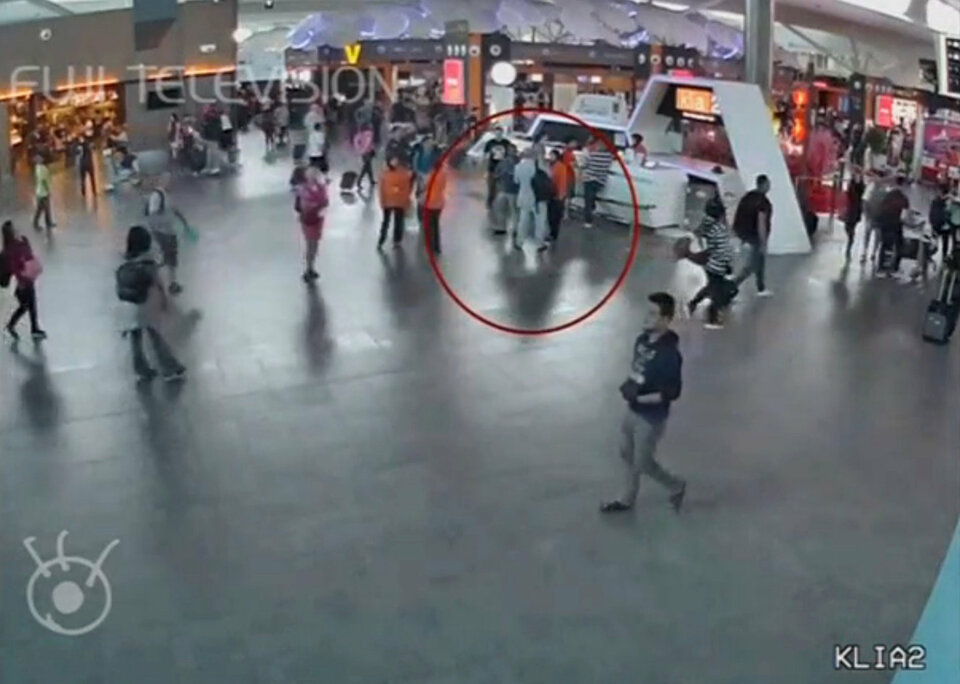 A still image from a CCTV footage appears to show a man purported to be Kim Jong-nam (circled in red) talking to airport staff, after being accosted by a woman in a white shirt, at Kuala Lumpur International Airport in Malaysia on February 13, 2017. (Reuters Photo/FUJITV)