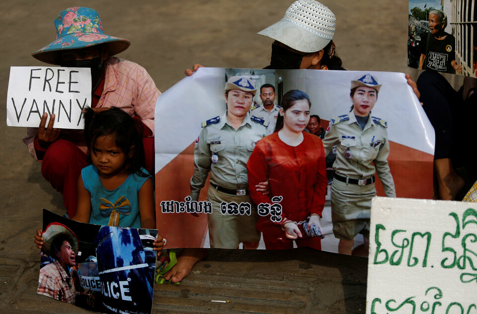 Protesters hold an image of land-rights activist Tep Vanny as they demonstrate in support her, in front of the Phnom Penh Municipal Court on Feb. 23. (Reuters Photo/Samrang Pring)