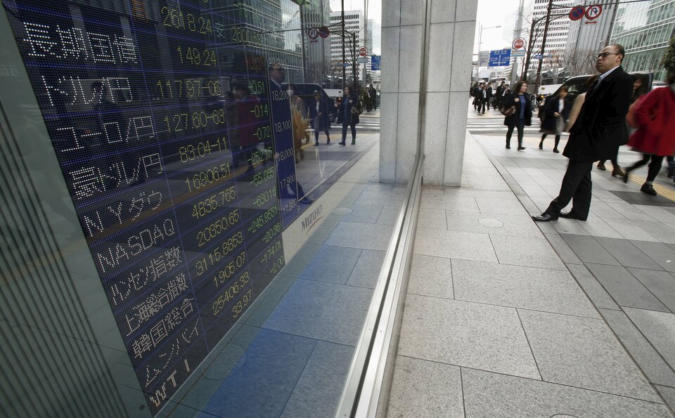 Exchange rates displayed on an electronic billboard at a brokerage in Tokyo. (Reuters Photo/Yuya Shino)