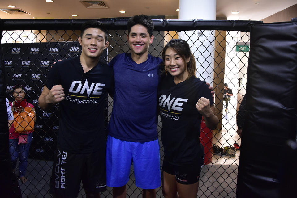 Joseph Schooling, center, with Angela Lee on the right. (Photo courtesy of ONE Championship)