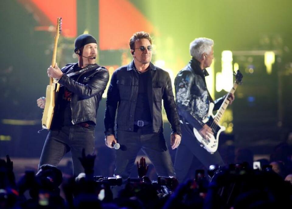 Bono (center), guitarist The Edge (left) and bass guitarist Adam Clayton of U2 perform during the iHeartRadio Music Festival at The T-Mobile Arena in Las Vegas, Nevada, US on September 23, 2016. (Reuters Photo/Steve Marcus/File Photo)