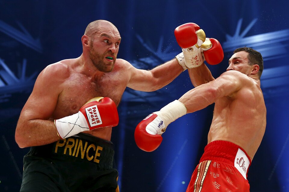 Britain's former world heavyweight champion Tyson Fury, left, has said he will make a comeback against an unnamed opponent in May, even though he is under a provisional suspension from the sport. (Reuters Photo/Kai Pfaffenbach)
