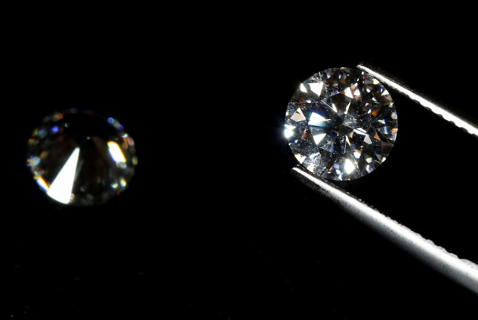 Diamond merchants in India's biggest center for trading the precious gemstones say they had stopped dealing with Nirav Modi and his uncle Mehul Choksi - two big-name jewelers accused of massive bank fraud.
 (Reuters Photo/Stefano Rellandini)