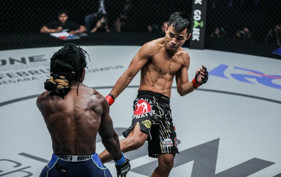 Stefer Rahardian, right, in a fight against Jerome S. Paye on Jan. 14. (Photo courtesy of ONE Championship)