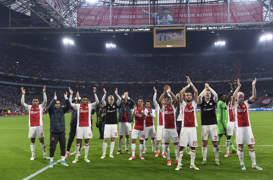 Ajax players celebrate after their first-leg semifinal match against Olympique Lyonnais. (Reuters Photo/Toussaint Kluiters)