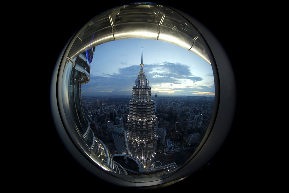 A view of one of the Petronas Towers in Kuala Lumpur is seen from a window of its twin building. (Reuters Photo/Jorge Silva)