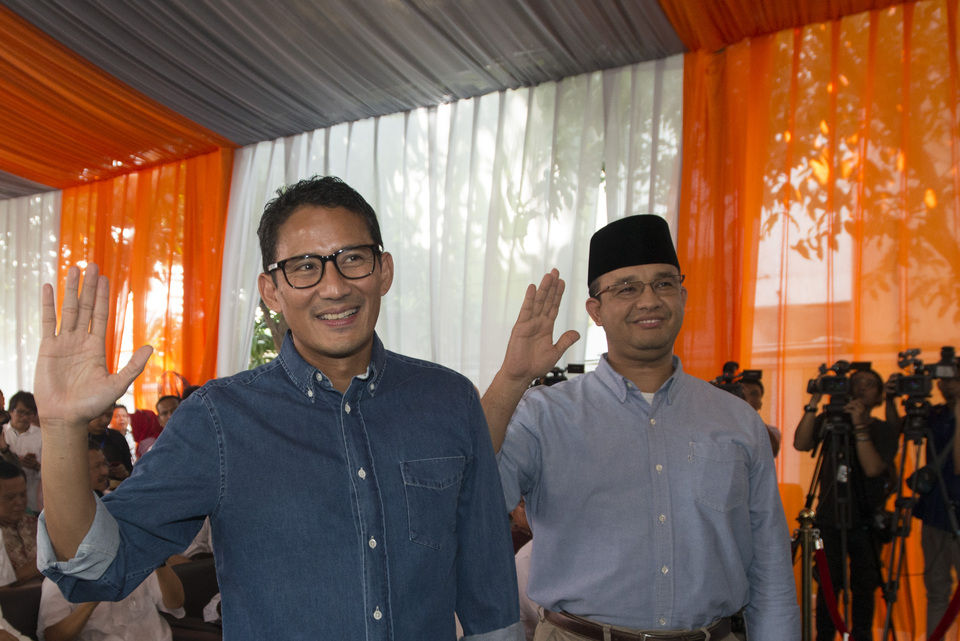 Anies Baswedan, right, and running mate Sandiaga Uno were declared as official winners of the Jakarta election runoff on Friday (05/05) by the Jakarta Election Commission. (Antara Photo/Rosa Panggabean)