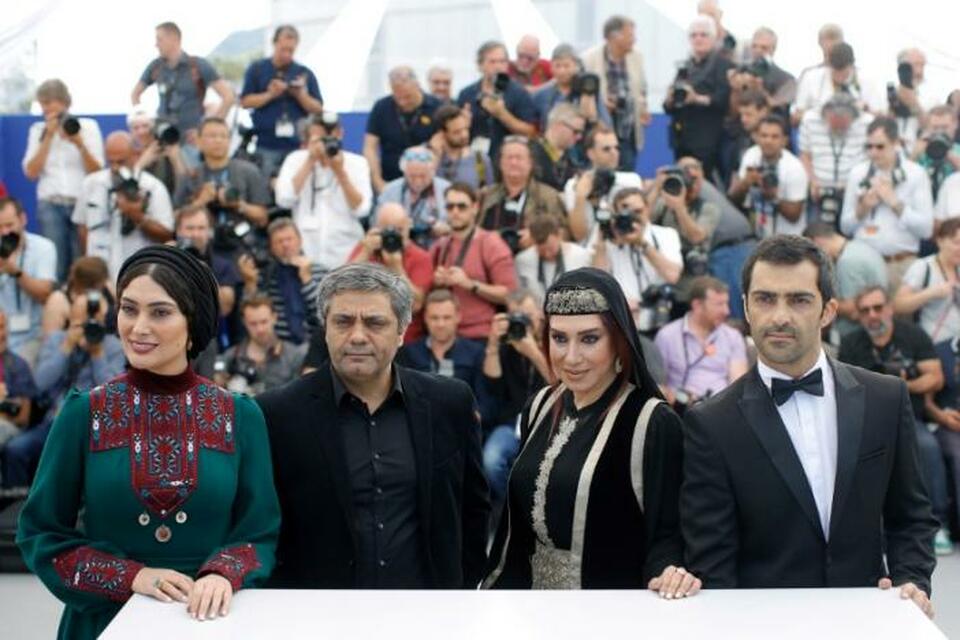 Iranian director Mohammad Rasoulof and cast members Nasim Adabi, Mohammad Akhlaghirad, Soudabeh Beizaee pose. (Reuters Photo/Stephane Mahe/File Photo)