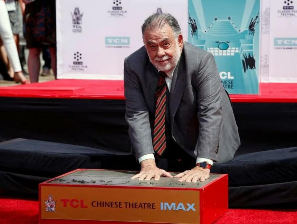 Director Francis Ford Coppola places his handprints in cement during a ceremony in the forecourt of the TCL Chinese theatre in Hollywood, US, April 29, 2016. (Reuters Photo/Mario Anzuoni)