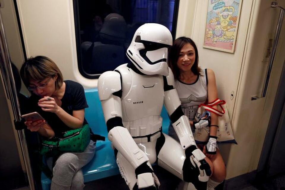 A fan dressed as a Storm Trooper from "Star Wars" reacts at the Taipei Metro (MRT) during Star Wars Day in Taipei, Taiwan May 4, 2017. (Reuters Photo/Tyrone Siu)