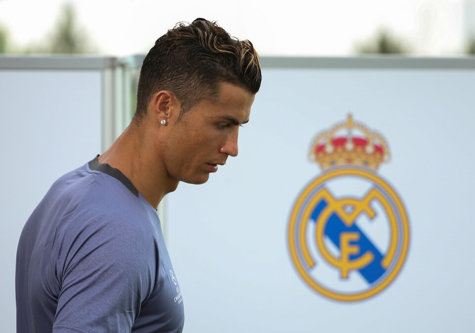 Real Madrid's Cristiano Ronaldo arrives at a television set after a training session during open media day on May 30. (Reuters Photo/Sergio Perez)
