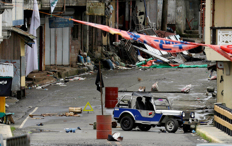 The seizing of the city by Maute and its allies on the island of Mindanao is the biggest warning yet that the Islamic State is building a base in Southeast Asia and bringing the brutal tactics seen in Iraq and Syria in recent years to the region. (Reuters Photo/Erik De Castro)