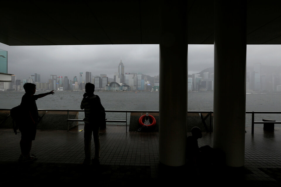 Hong Kong was bracing on Sunday for Typhoon Roke with winds reaching 73 kilometers per hour, forcing authorities to shut some services and events in the Asian financial hub, though the city's international airport continued operating as usual. (Reuters Photo/Bobby Yip)