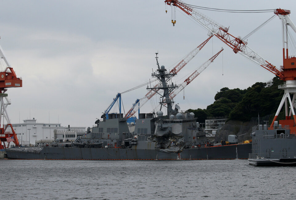 The Arleigh Burke-class guided-missile destroyer USS Fitzgerald, damaged by colliding with a Philippine-flagged merchant vessel, is seen at the US naval base in Yokosuka, south of Tokyo, on June 18, 2017.  (Reuters Photo/Toru Hanai)
