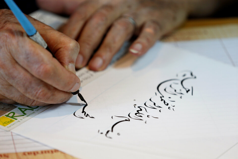 Lebanese calligrapher, Mahmoud Bayoun, writes 