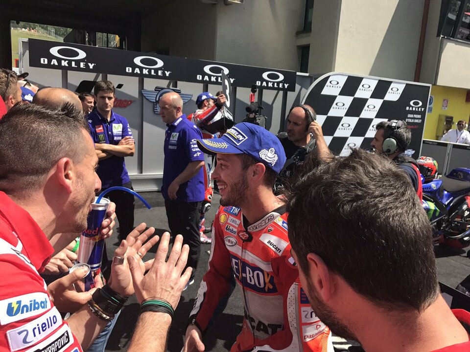 Andrea Dovizioso congratulated by teammates. (Photo Courtesy of Twitter/Ducati Motor)