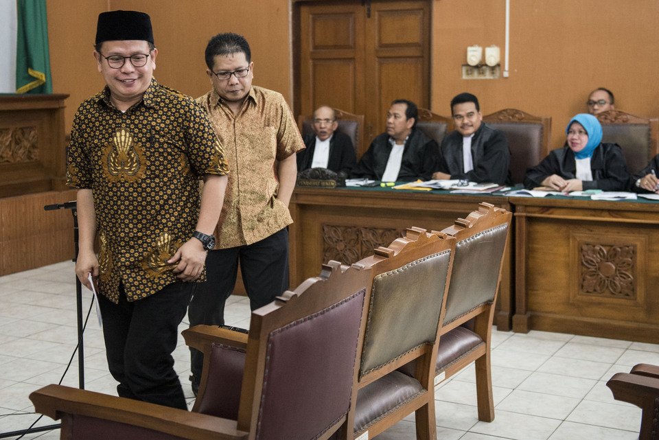 Jamran left, and Rizal during a previous court appearance in May. (Antara Photo/M. Agung Rajasa)