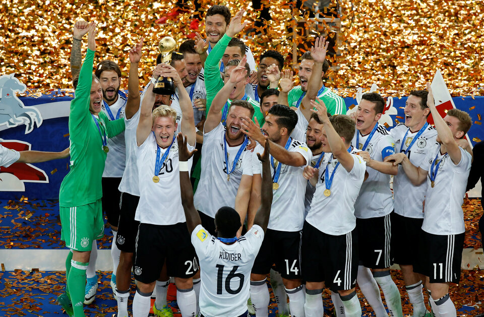 Germany’s Julian Brandt celebrates with the trophy and team mates after winning the FIFA Confederations Cup. (Reuters Photo/Maxim Shemetov)