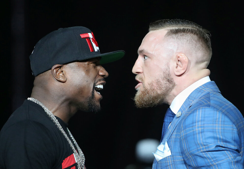 Floyd Mayweather and Conor McGregor stare each other down during a world tour press conference to promote the upcoming Mayweather vs McGregor boxing fight. (Reuters Photo/Tom Szczerbowski-USA TODAY Sports)
